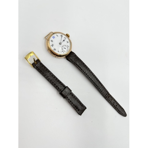 1249 - A 1930s stamped 9ct gold cased lady's mechanical wristwatch with white enamel face and sub second di... 