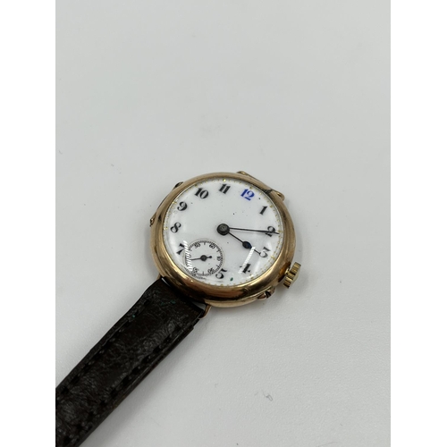 1249 - A 1930s stamped 9ct gold cased lady's mechanical wristwatch with white enamel face and sub second di... 