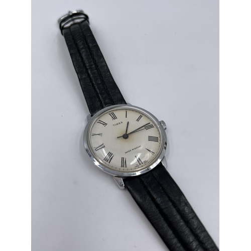 1250 - A vintage Timex mechanical wristwatch with black leather strap