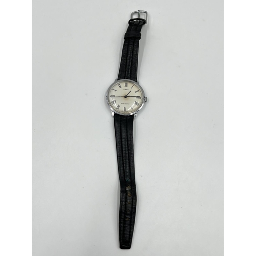 1250 - A vintage Timex mechanical wristwatch with black leather strap