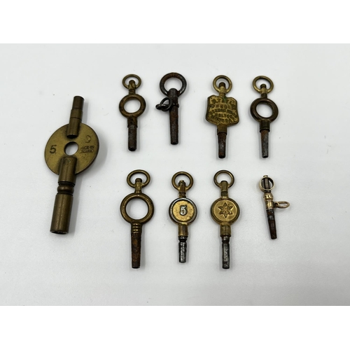 1251 - A collection of nine antique pocket watch and carriage clock keys