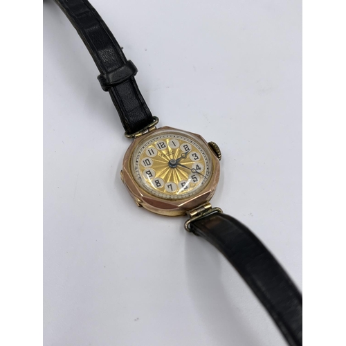 1252 - A 1930s Marbla 9ct gold cased mechanical wristwatch with black leather strap - approx. gross weight ... 