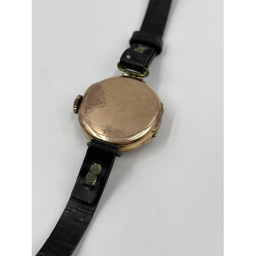 1252 - A 1930s Marbla 9ct gold cased mechanical wristwatch with black leather strap - approx. gross weight ... 