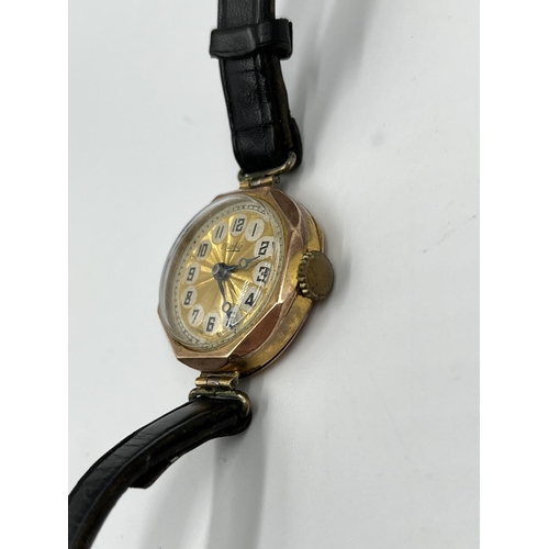 1252 - A 1930s Marbla 9ct gold cased mechanical wristwatch with black leather strap - approx. gross weight ... 