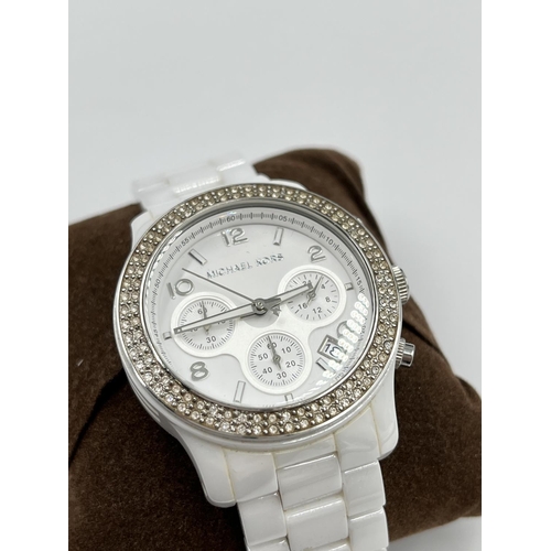 1259 - A boxed Michael Kors men's quartz wristwatch with ceramic bracelet and dial - model no. MK-5188