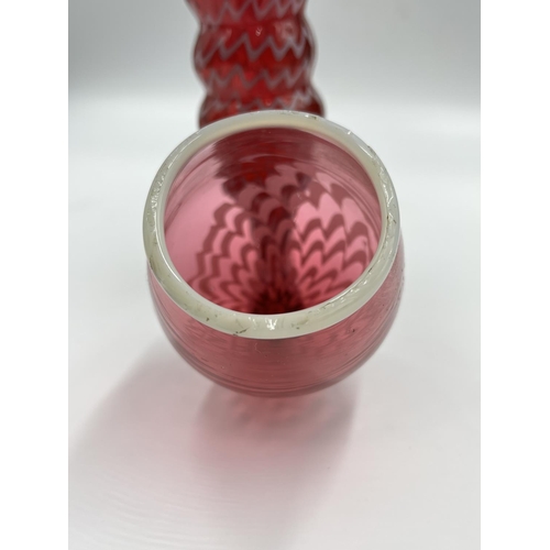 21 - A 19th century Nailsea cranberry and white swirl glass pipe - approx. 38cm long