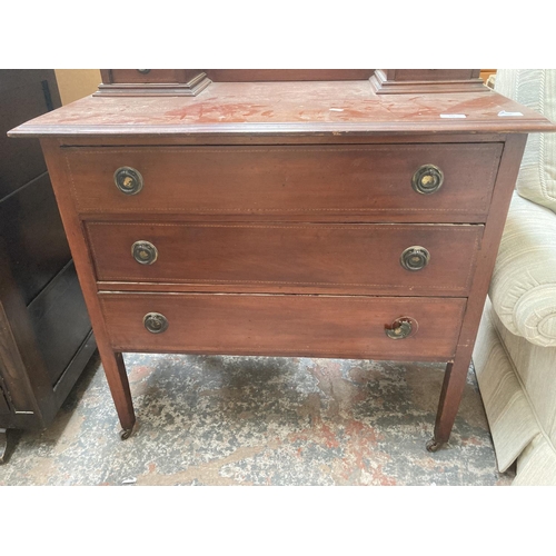 425 - An Edwardian inlaid mahogany dressing chest with three long drawers, two trinket drawers and upper o... 