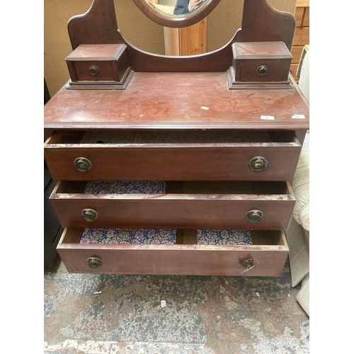 425 - An Edwardian inlaid mahogany dressing chest with three long drawers, two trinket drawers and upper o... 