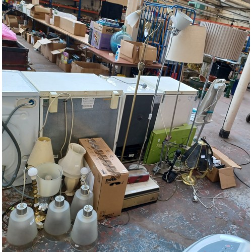 674A - A large quantity of items to include floorstanding lamps, table lamps, ceiling lights, computer moni... 