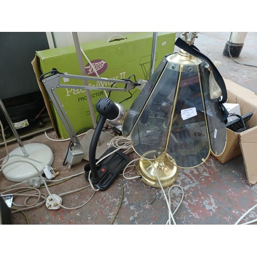 674A - A large quantity of items to include floorstanding lamps, table lamps, ceiling lights, computer moni... 