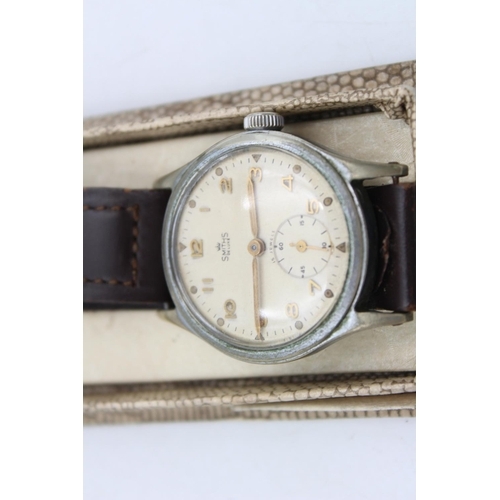 87 - A boxed 1950s Smiths De Luxe hand wind gents wristwatch with certificate dated June 1st 1954 and Bri... 