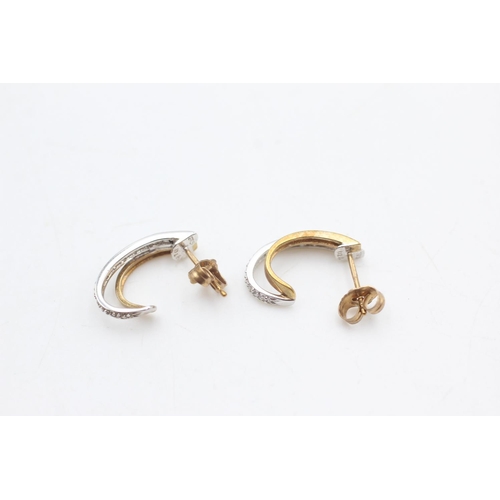 2003 - A pair of 9ct gold diamond two tone hoop earrings - approx. gross weight 2.1 grams