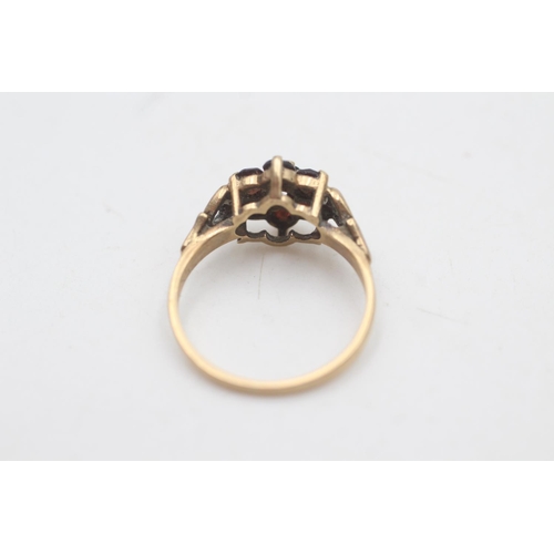 2008 - A hallmarked Birmingham 9ct gold garnet cluster heart shoulders ring, size O - approx. gross weight ... 