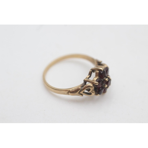 2008 - A hallmarked Birmingham 9ct gold garnet cluster heart shoulders ring, size O - approx. gross weight ... 