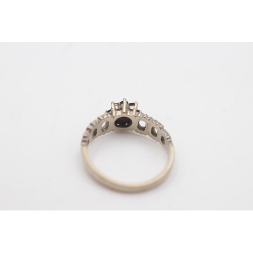 2010 - An 18ct white gold diamond and sapphire cluster tree bark texture ring, size N½ - approx. gross weig... 