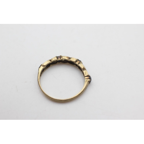 2011 - A 9ct gold sapphire and diamond half eternity ring, size M - approx. gross weight 1.2 grams