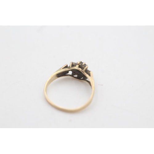 2014 - A 9ct gold sapphire and clear gemstone floral halo set ring, size J½ - approx. gross weight 1.5 gram... 