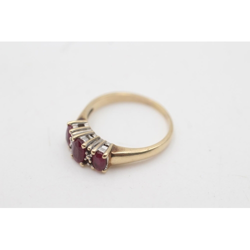 2018 - A 14ct gold ruby and diamond seven stone dress ring, size Q - approx. gross weight 4.1 grams