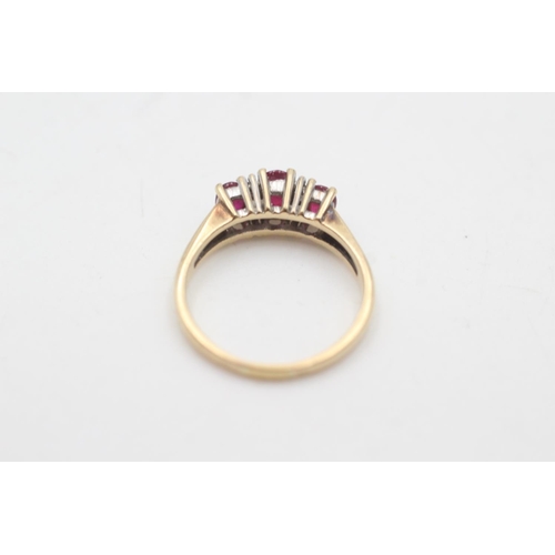 2018 - A 14ct gold ruby and diamond seven stone dress ring, size Q - approx. gross weight 4.1 grams