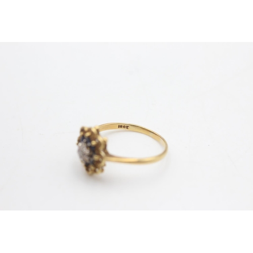 2022 - An 18ct gold diamond and sapphire ornate floral halo setting ring, size O½ - approx. gross weight 3 ... 