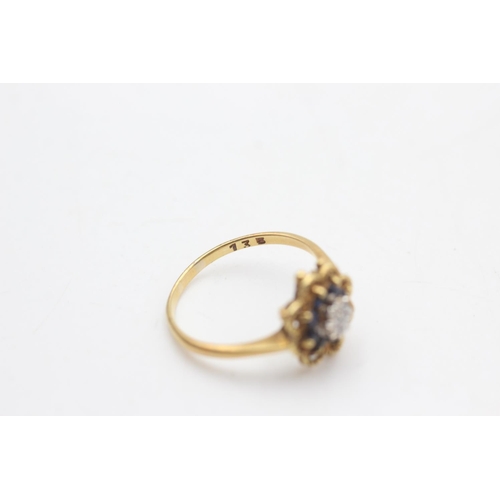 2022 - An 18ct gold diamond and sapphire ornate floral halo setting ring, size O½ - approx. gross weight 3 ... 