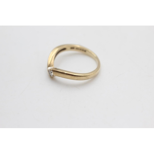 2033 - A hallmarked Sheffield 9ct gold diamond solitaire wishbone ring, size K½ - approx. gross weight 2.3 ... 