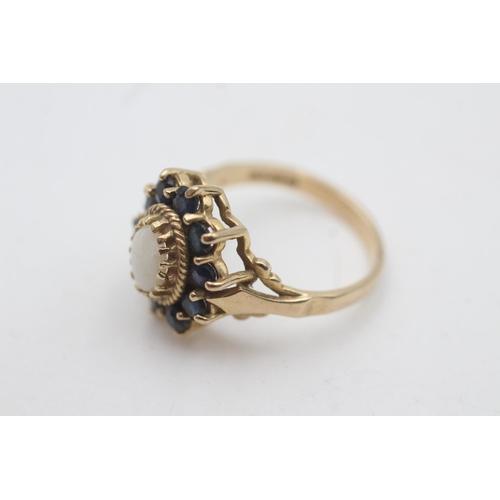 2034 - A hallmarked London 9ct gold opal and sapphire halo setting dress ring, size O½ - approx. gross weig... 