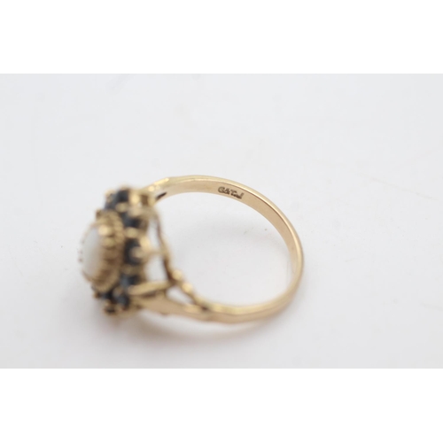 2034 - A hallmarked London 9ct gold opal and sapphire halo setting dress ring, size O½ - approx. gross weig... 