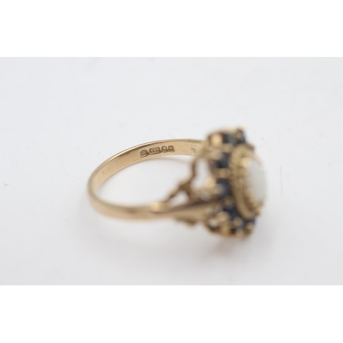 2034 - A hallmarked London 9ct gold opal and sapphire halo setting dress ring, size O½ - approx. gross weig... 