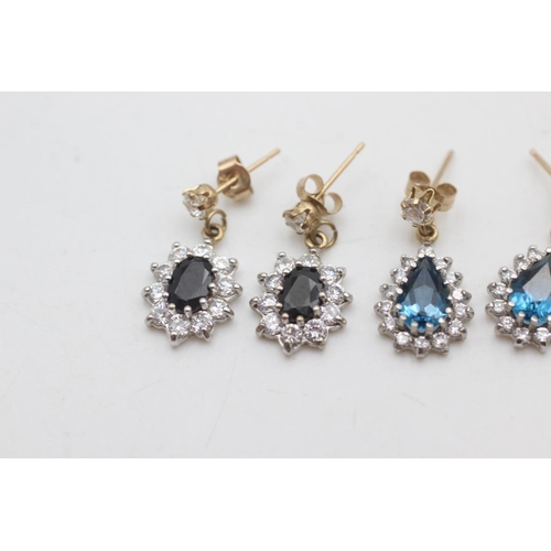 2038 - Two pairs of 9ct gold and clear gemstone halo drop earrings, one sapphire and one topaz - approx. gr... 