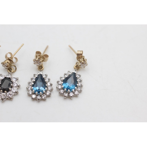 2038 - Two pairs of 9ct gold and clear gemstone halo drop earrings, one sapphire and one topaz - approx. gr... 