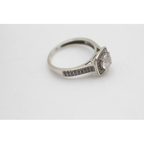 2039 - A 9ct white gold clear gemstone halo and shoulders set cathedral setting ring, size M½ - approx. gro... 