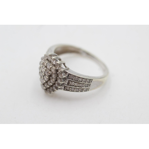 2043 - A hallmarked London 9ct white gold diamond cluster cocktail ring, size P½ - approx. gross weight 4 g... 