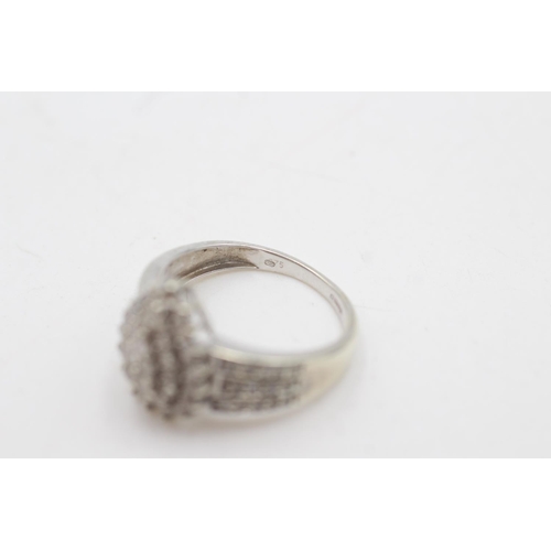 2043 - A hallmarked London 9ct white gold diamond cluster cocktail ring, size P½ - approx. gross weight 4 g... 