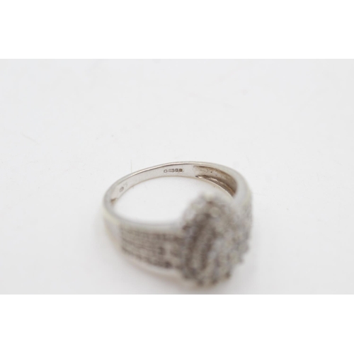 2043 - A hallmarked London 9ct white gold diamond cluster cocktail ring, size P½ - approx. gross weight 4 g... 