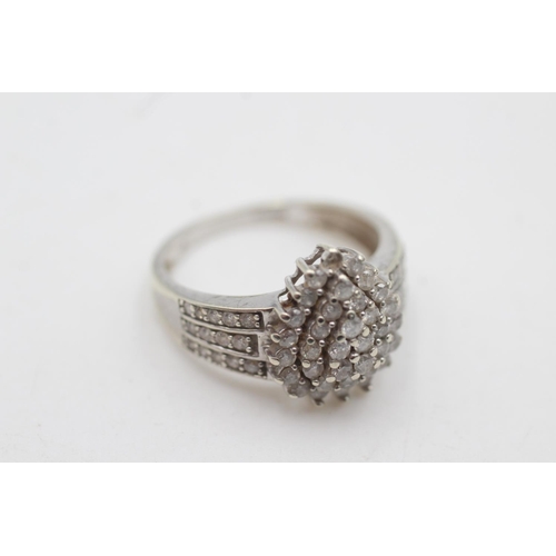 2043 - A hallmarked London 9ct white gold diamond cluster cocktail ring, size P½ - approx. gross weight 4 g... 