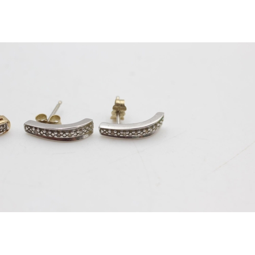 2052 - Two pairs of 9ct yellow and white gold diamond set half-hoop earrings - approx. gross weight 2.3 gra... 