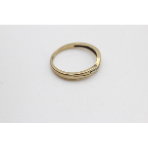 2053 - A 9ct gold diamond wishbone shaped ring, size N - approx. gross weight 1.6 grams