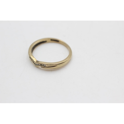 2053 - A 9ct gold diamond wishbone shaped ring, size N - approx. gross weight 1.6 grams