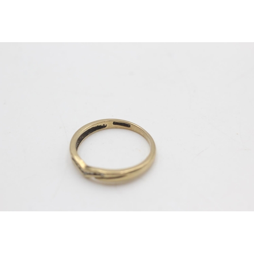 2053 - A 9ct gold diamond wishbone shaped ring, size N - approx. gross weight 1.6 grams