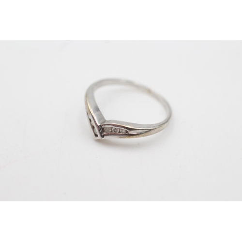 2055 - A 9ct white gold diamond channel setting wishbone ring, size K - approx. gross weight 1.7 grams