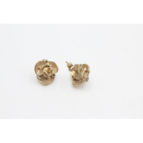 2056 - A pair of 9ct gold pearl and diamond stud earrings - approx. gross weight 1.8 grams