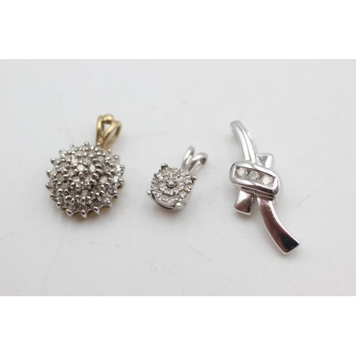 2061 - Three 9ct yellow and white gold diamond set pendants, one halo, one cluster and one ribbon - approx.... 