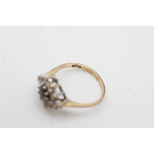 2062 - A 9ct gold sapphire and clear gemstone cluster dress ring, size M½ - approx. gross weight 2.3 grams