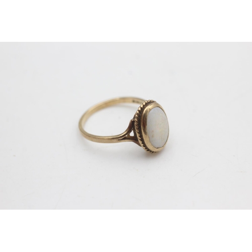 2100 - A hallmarked London 9ct gold white opal solitaire ring, size O - approx. gross weight 2.5 grams