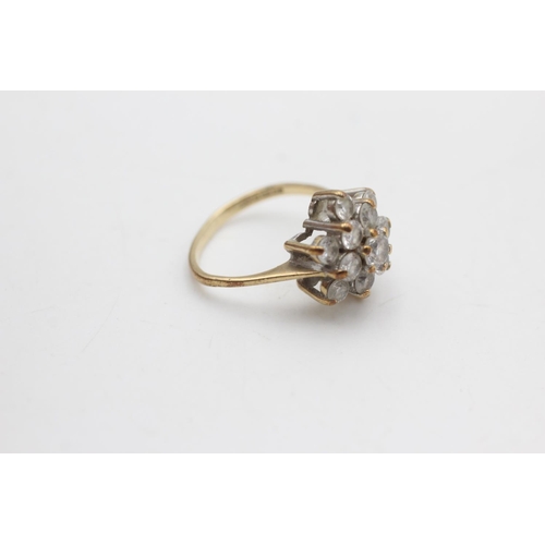 2102 - A hallmarked London 9ct gold clear gemstone floral set dress ring, size M½ - approx. gross weight 3.... 