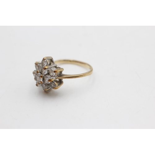 2102 - A hallmarked London 9ct gold clear gemstone floral set dress ring, size M½ - approx. gross weight 3.... 