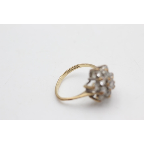 2102 - A hallmarked London 9ct gold clear gemstone floral set dress ring, size M½ - approx. gross weight 3.... 