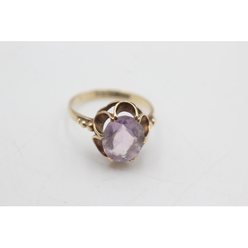 2106 - Two 9ct gold amethyst solitaire cocktail rings, one size K½ and one size L - approx. gross weight 5.... 