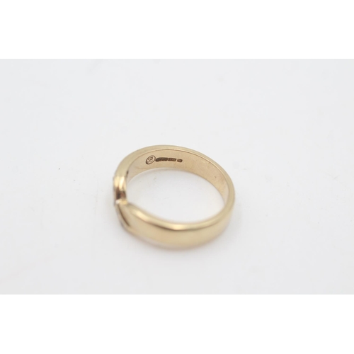 2107 - A hallmarked Birmingham 9ct gold diamond set single row wishbone ring, size J½ - approx. gross weigh... 